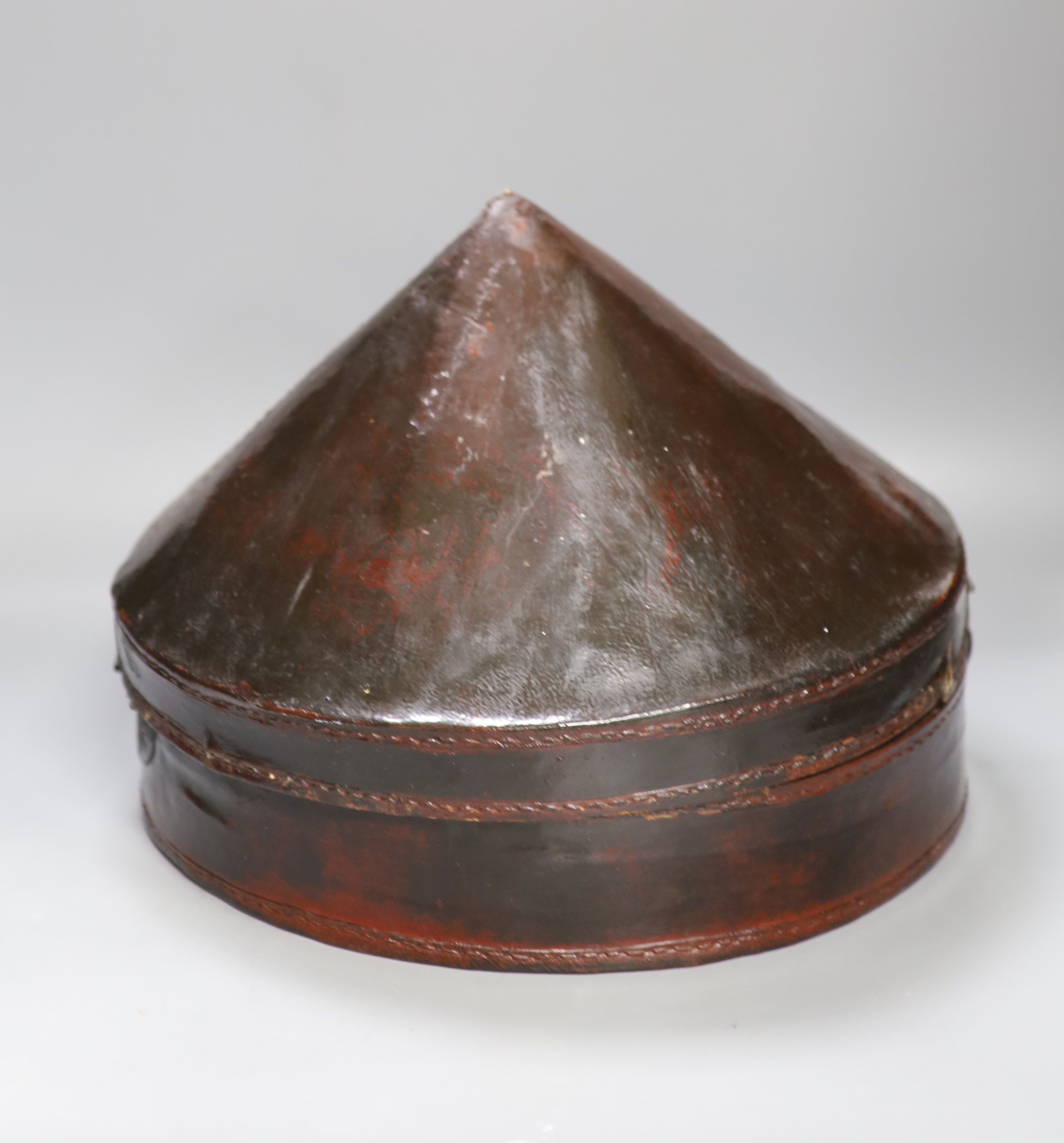 A Chinese late Qing mandarin hat, with gilt finial and original hide case